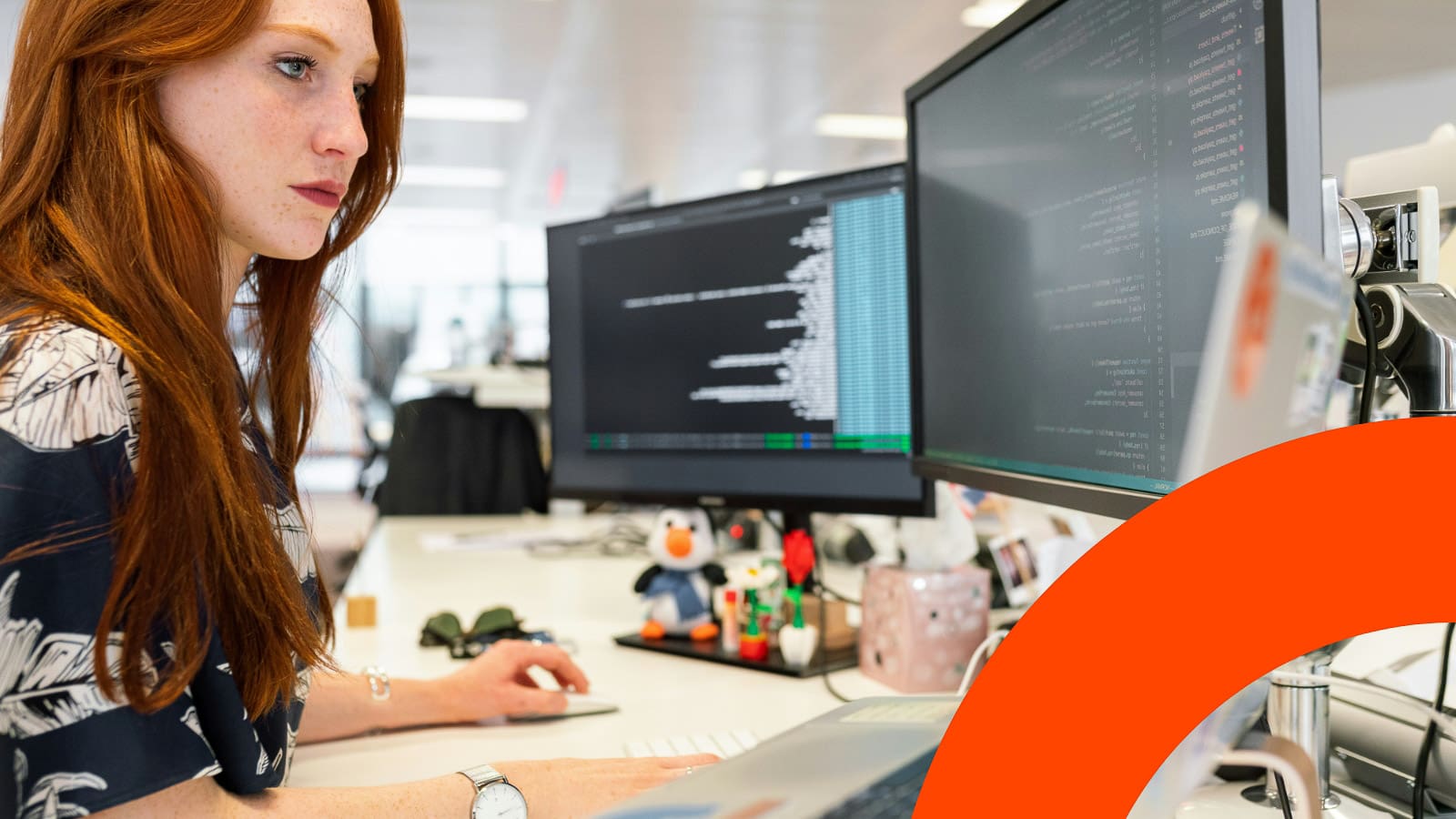 woman-work-on-computer-orange-arc-compressed